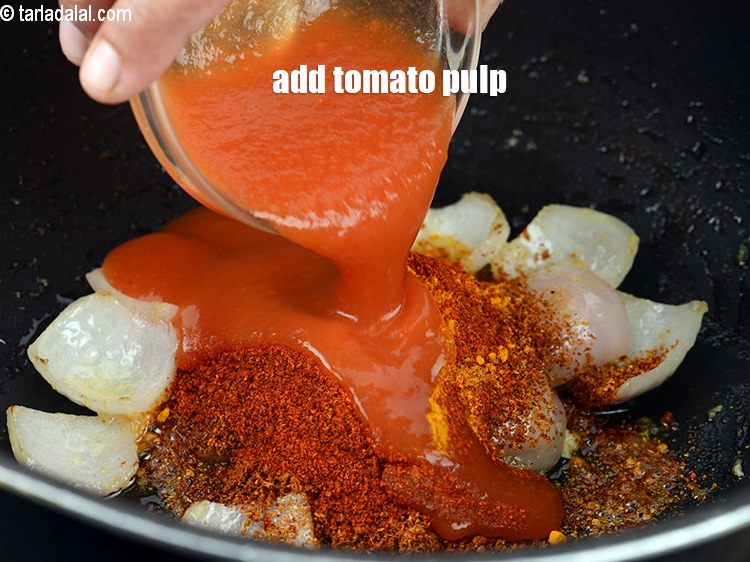 Step 23 – Add &frac14; cup <a href="https://www.tarladalal.com/glossary-tomato-pulp-tamatar-ka-pulp-1039i">tomato pulp</a>.