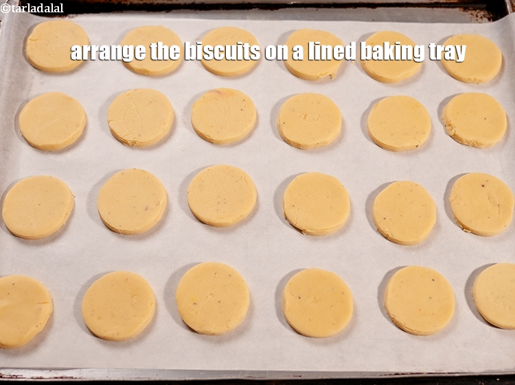 Step 22 – Arrange the biscuits on a lined baking tray.