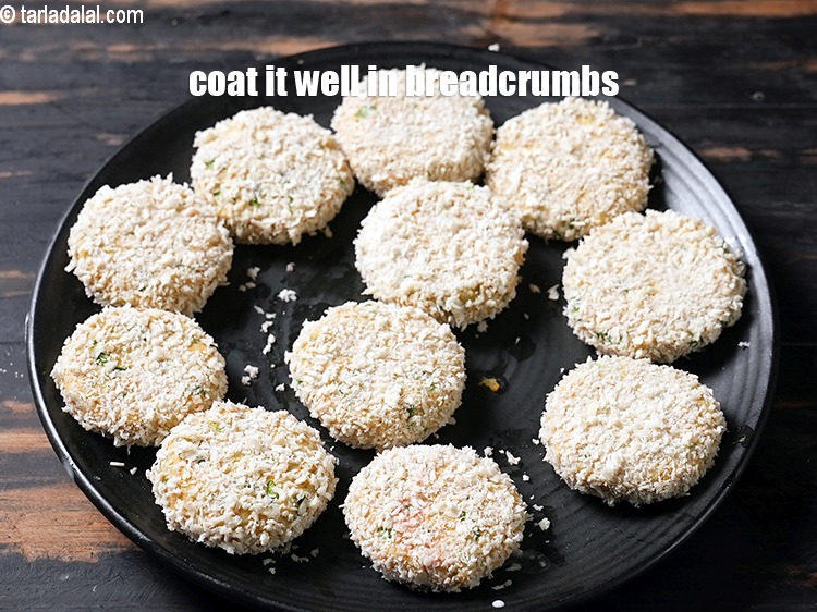 Step 22 – Then coat it well in the breadcrumbs.