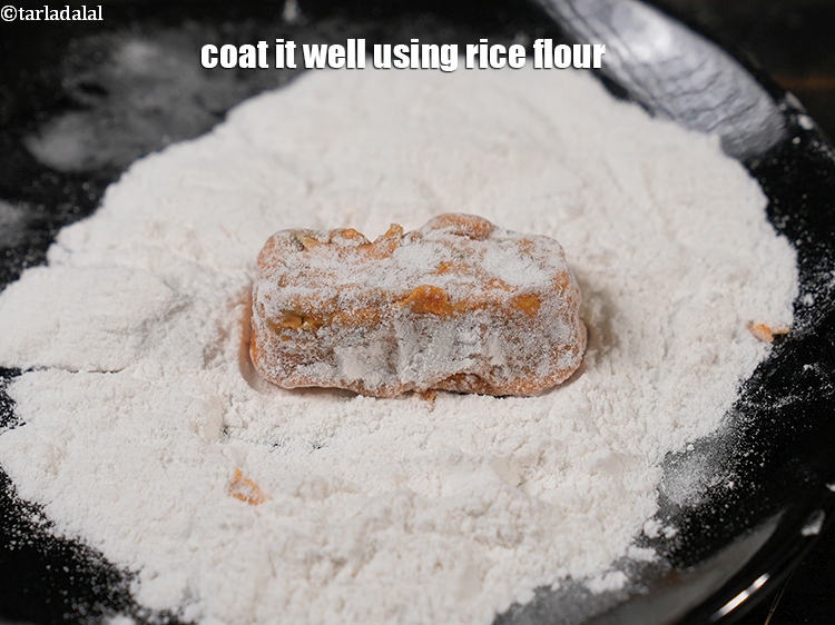 Step 22 – Coat it well using rice flour.