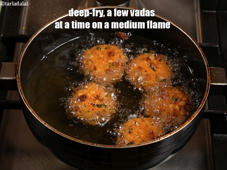 Step 22 – Deep-fry, a few vadas at a time on a medium flame.