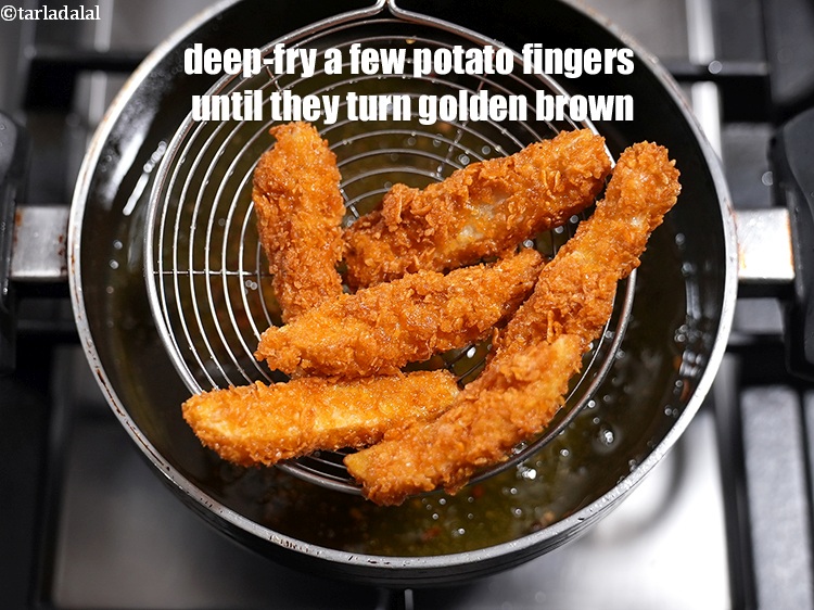 Step 22 – Heat the oil in a kadhai and deep-fry a few potato fingers, at a time, …
