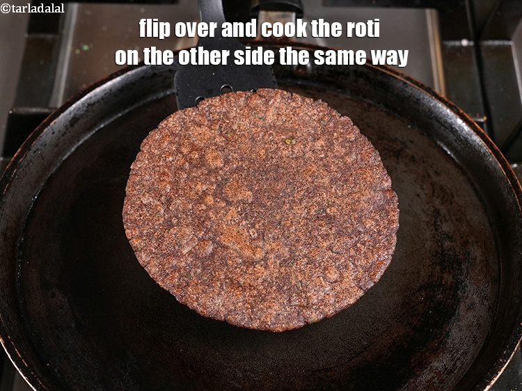 Step 24 – Flip over and cook the roti on the other side the same way.