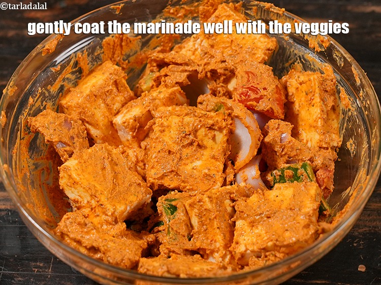 Step 22 – Gently coat the marinade well with the veggies. Keep aside for 15 minutes.&nbsp;