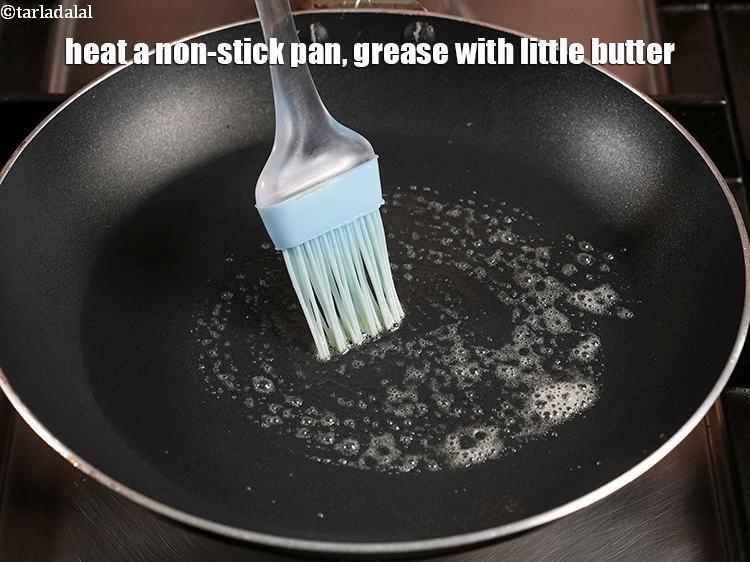 Step 22 – Heat a non-stick pan, grease with little butter.