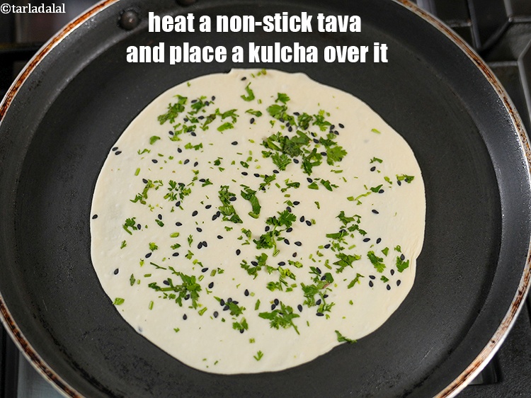 Step 22 – Heat a non-stick tava (griddle) and place a kulcha over it.