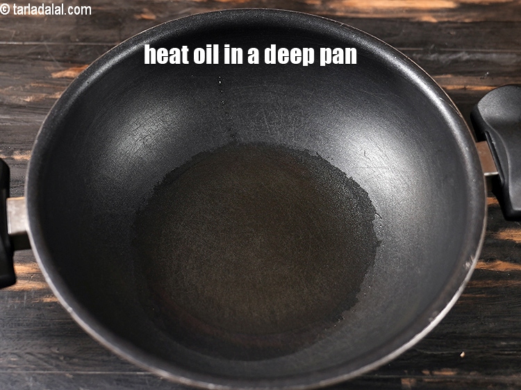 Step 22 – Heat 3 tbsp oil in a deep pan.