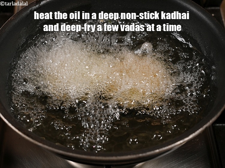 Step 22 – Heat the oil in a deep non-stick kadhai and deep-fry a few vadas at a …