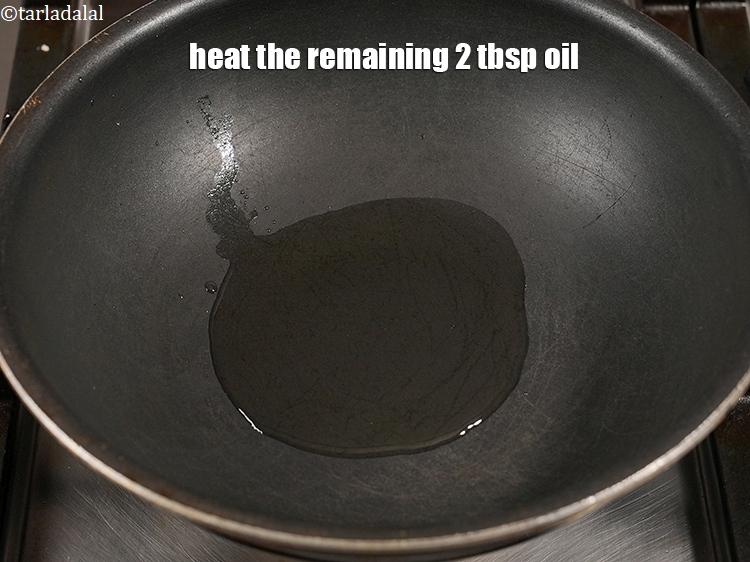 Step 22 – Heat the remaining 2 tbsp <a href="https://www.tarladalal.com/glossary-oil-671i">oil</a>.