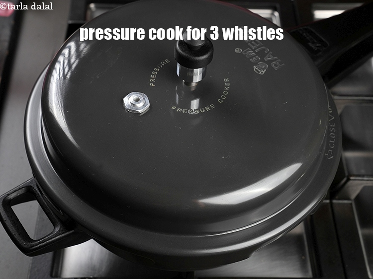Step 22 – Mix well and pressure cook for 3 whistles. &nbsp;&nbsp;