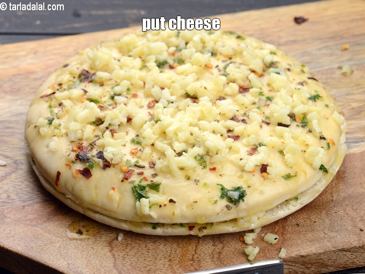 Step 22 – Put little cheese evenly over it.&nbsp;