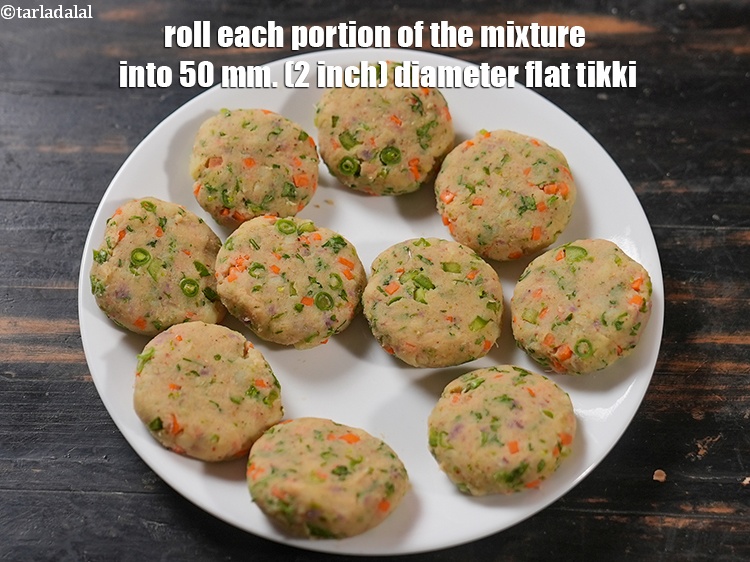 Step 22 – Roll each portion of the mixture into 50 mm. (2 inch) diameter flat tikki.