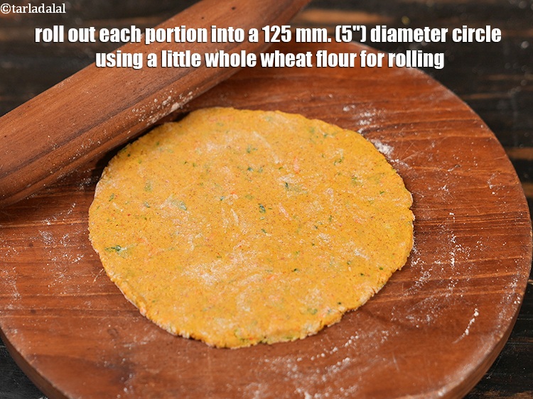 Step 21 – Roll out each portion into a 125 mm. (5&quot;) diameter circle using a little whole …