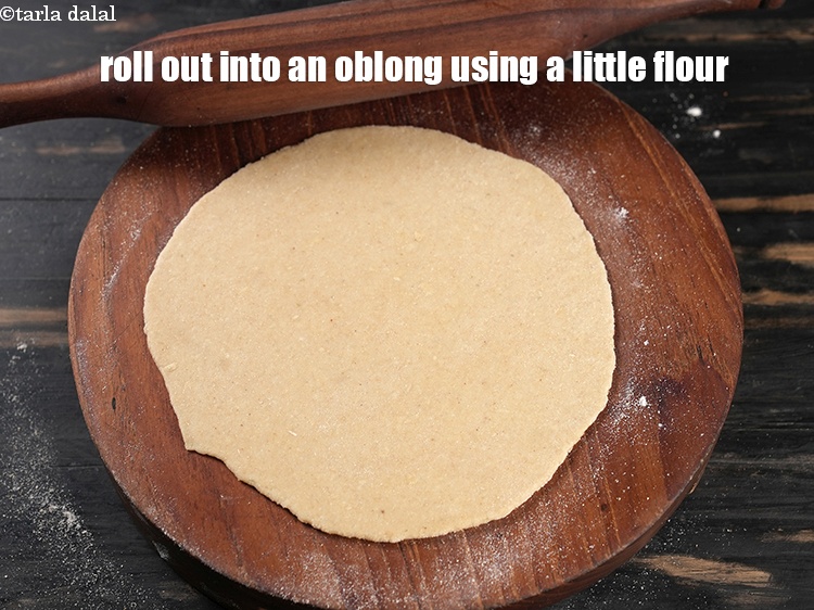 Step 22 – Roll out into an oblong of 150 mm. (6&quot;) using a little whole wheat flour …