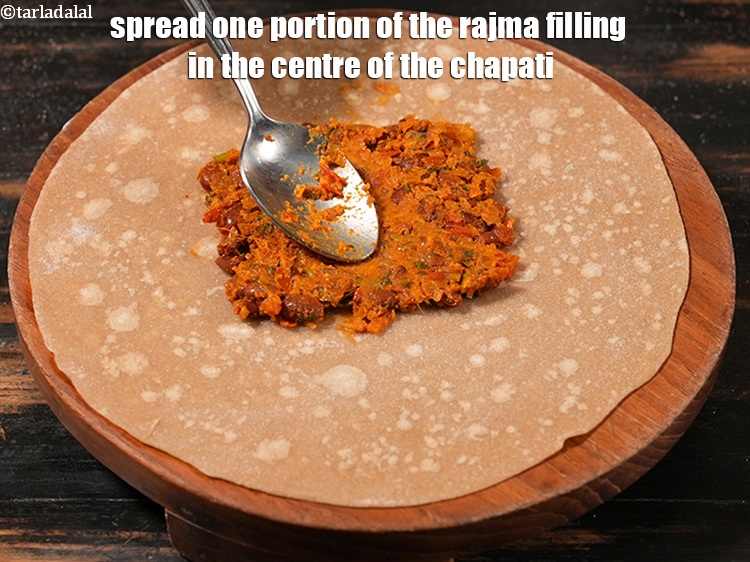 Step 41 – Spread one portion of the rajma filling in the centre of the chapati.