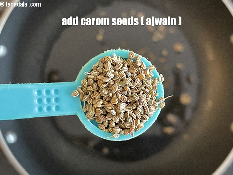 Step 22 – Add&nbsp;<meta charset="UTF-8" />1/2 tsp&nbsp;<a href="glossary-carom-seeds-ajwain-thymol-seeds-bishops-weed-266i">carom seeds (ajwain)</a>.