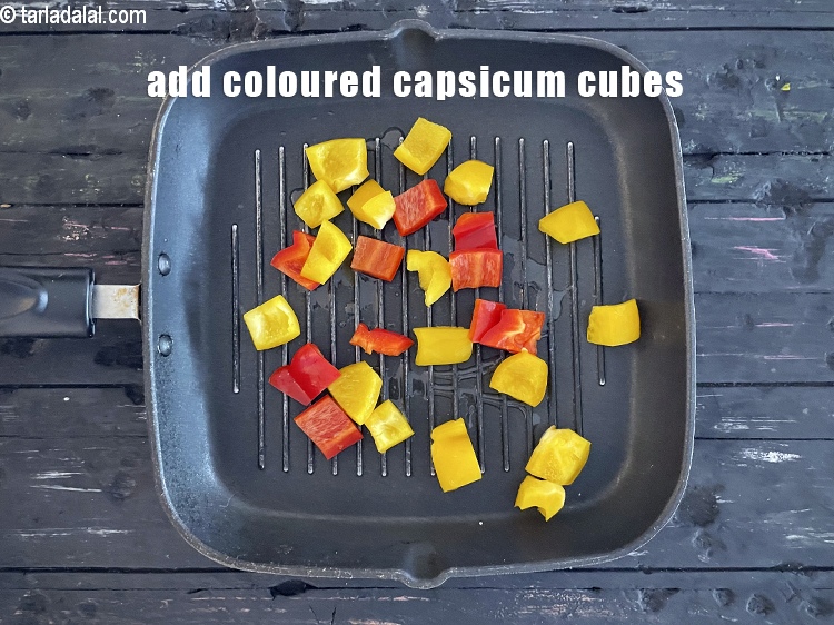 Step 22 – Add&nbsp;<meta charset="UTF-8" />1/2 cup&nbsp;coloured&nbsp;<a href="glossary-capsicum-cubes-170i">capsicum cubes</a>.
