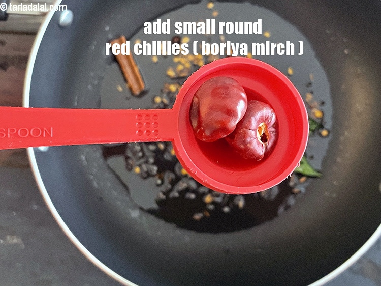 Step 52 – <meta charset="UTF-8" /> Add 2 small&nbsp;<a href="https://www.tarladalal.com/glossary-round-red-chillies-boriya-chilli-boria-mirch-1096i"><strong>round red chillies (boriya mirch)</strong></a>. The most crucial ingredients …