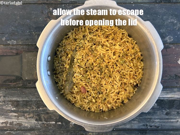 Step 30 – Allow the steam to escape before opening the lid.