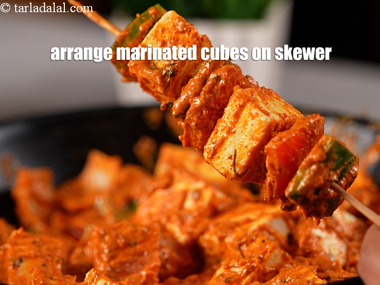 Step 22 – Arrange the marinated onion, tomato, capsicum and paneer cubes&nbsp;on a wooden skewer.