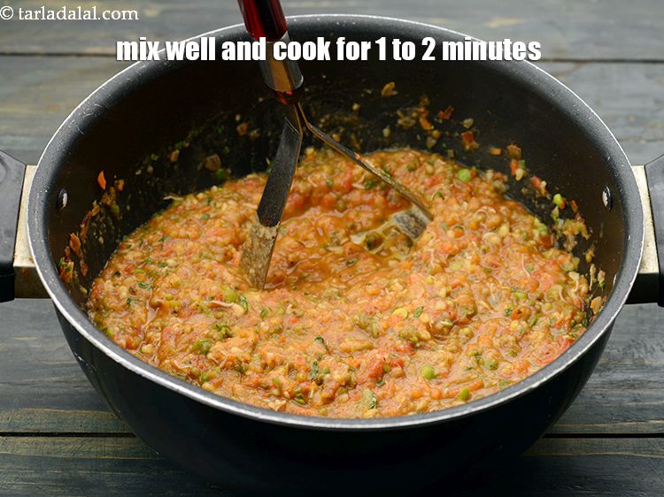 Step 27 – Mix well and cook while mashing using a potato masher on a medium flame for …