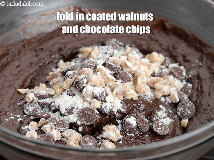 Step 22 – Fold in the coated walnuts and chocolate chips in the batter.