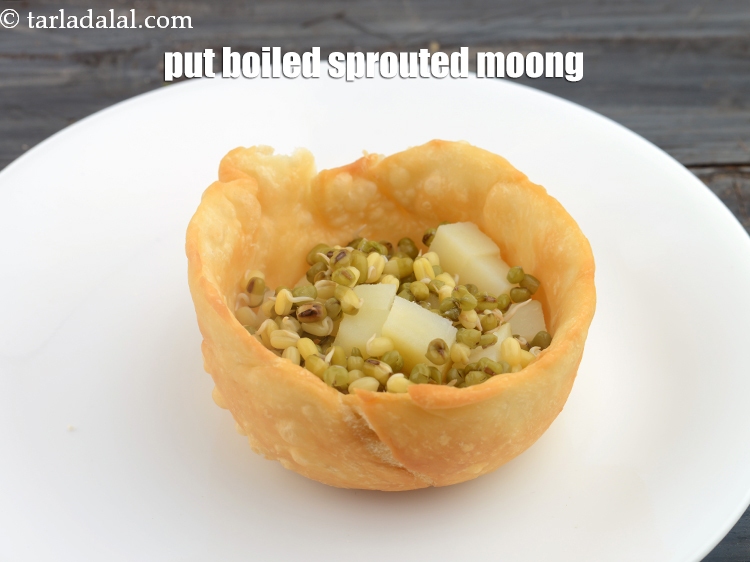 Step 24 – Put 1 tbsp <a href="https://www.tarladalal.com/glossary-boiled-sprouted-moong-boiled-sprouted-mung-boiled-mung-sprouts-1666i">boiled sprouted moong (whole green gram)</a>.