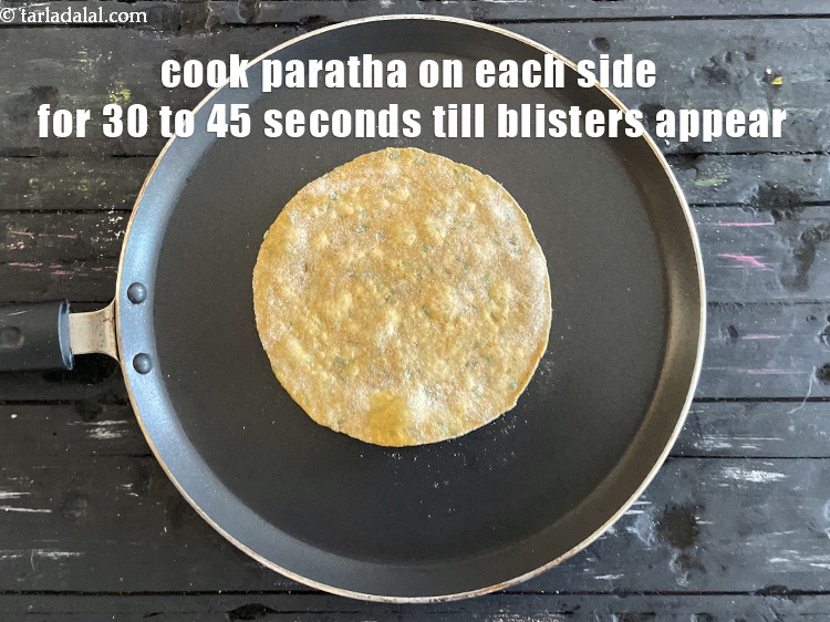 Step 22 – Cook paratha on each side for 30 to 45 seconds till small bubbles appear.