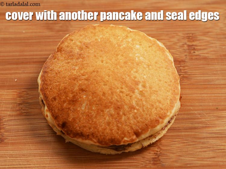 Step 22 – Cover with another pancake and seal the edges.
