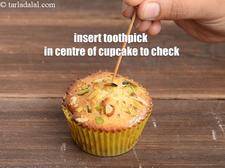 Step 28 – Insert a toothpick in the centre of the cupcake to check it&#39;s baked properly.