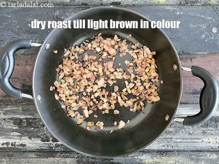 Step 22 – Dry roast till the onions turn light brown in colour.&nbsp;