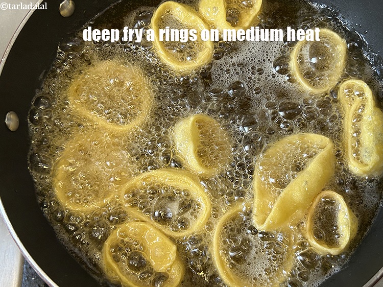 Step 22 – Deep-fry a few rings on medium flame. You will have to later fry 4 more …