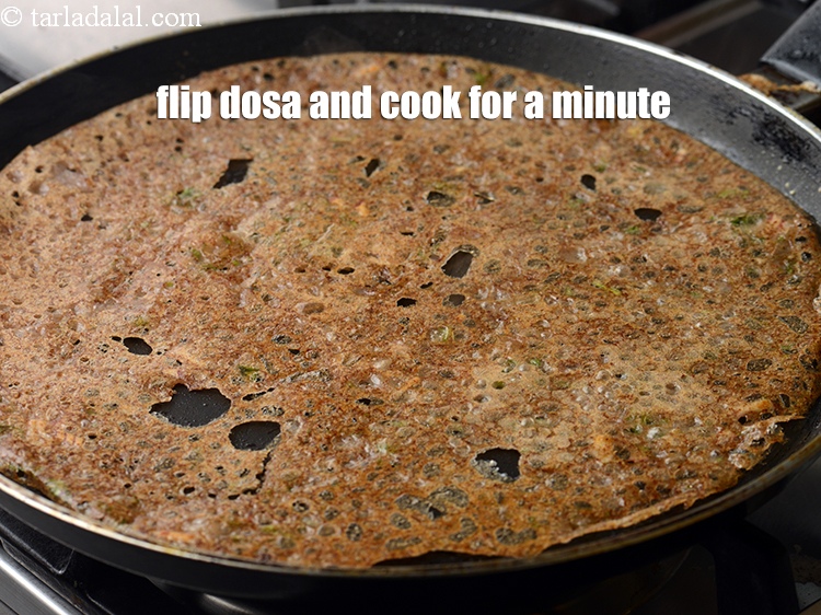 Step 22 – Flip the dosa and cook on medium flame for a minute till crispy.