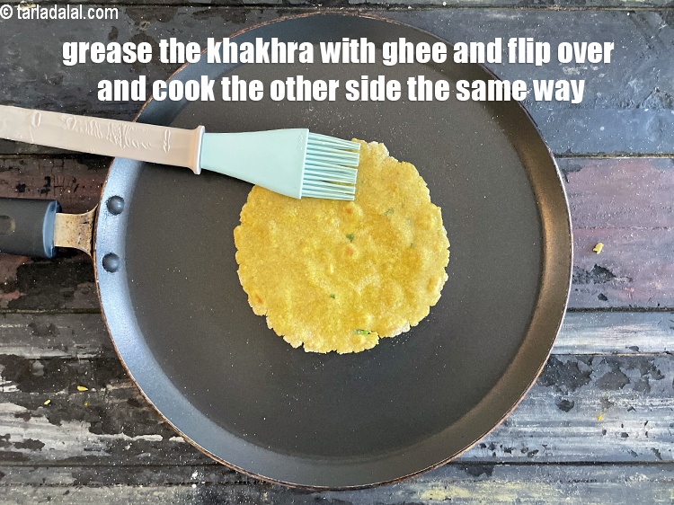 Step 22 – Grease the khakhra with ghee flip over and cook the other side for 30 seconds.