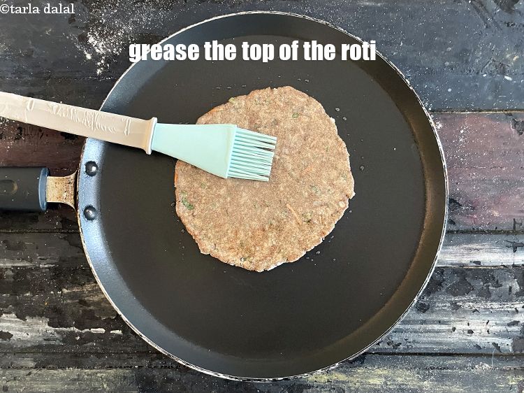 Step 22 – <meta charset="UTF-8" />Then grease the top of the roti.&nbsp;