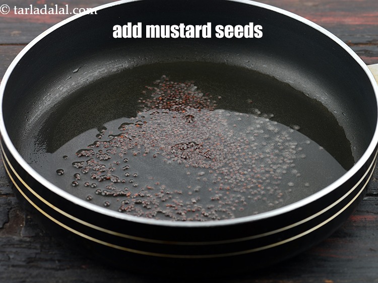 Step 22 – Add 2 tbsp&nbsp;<a href="https://www.tarladalal.com/glossary-mustard-seeds-sarson-rai-sarson-ke-beej-525i">mustard seeds ( rai / sarson)</a>