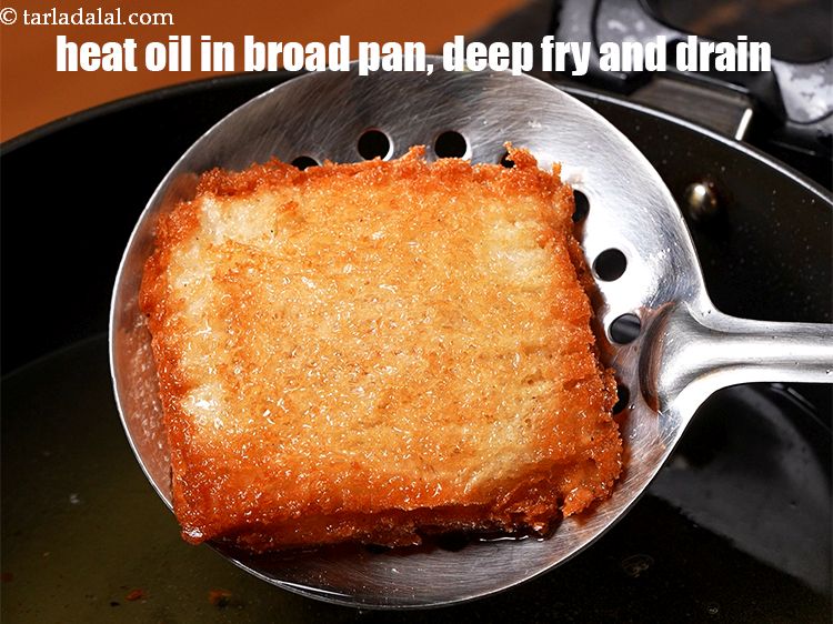 Step 22 – Heat the oil in a broad non-stick pan, deep fry the pizza puffs on medium …