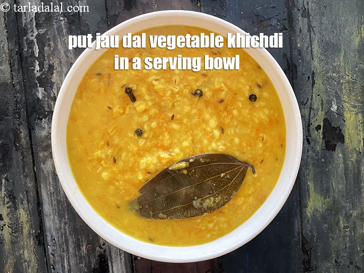 Step 31 – Put <strong>jau dal vegetable khichdi&nbsp;</strong>in a serving bowl.