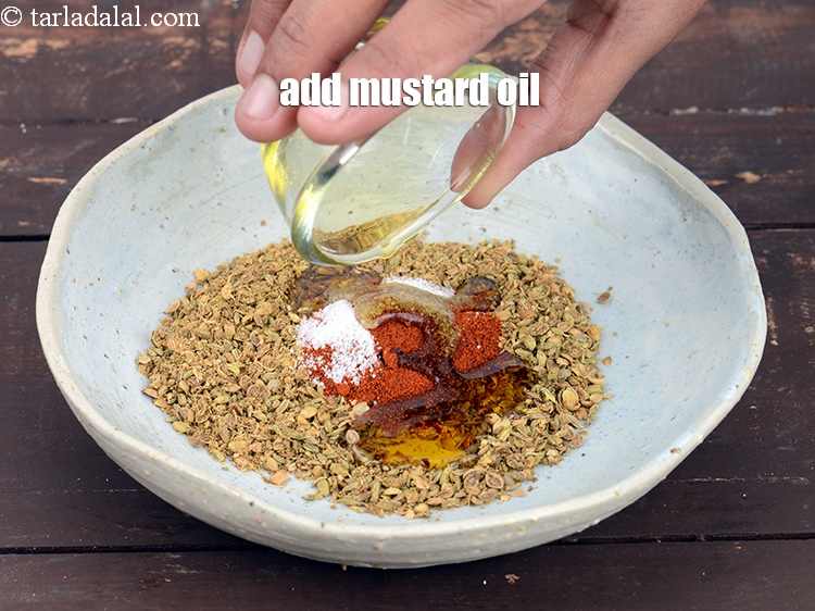 Step 23 – Add 4 tbsp&nbsp;<a href="https://www.tarladalal.com/glossary-mustard-oil-rai-ka-tel-sarson-ka-tel-942i">mustard (rai / sarson) oil</a>.