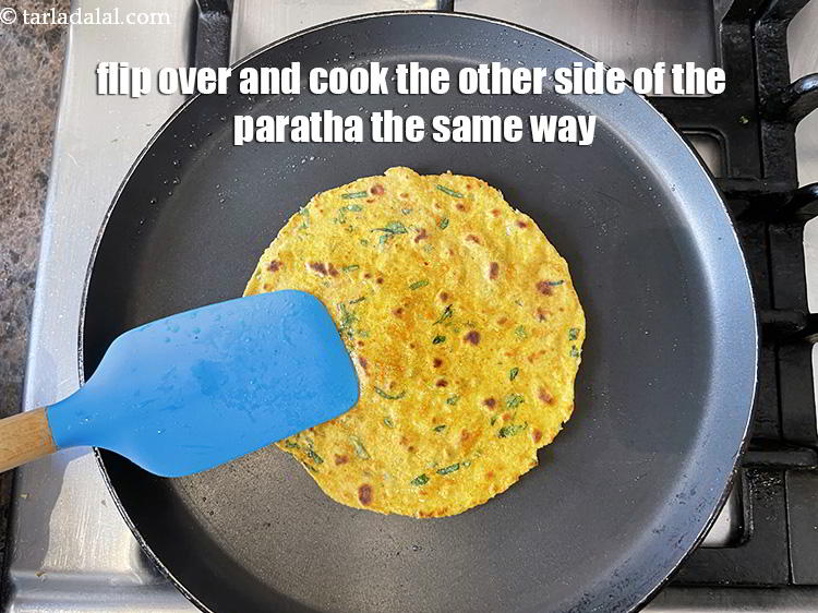 Step 22 – Flip over and cook the other side of the&nbsp;paratha the same way.&nbsp;