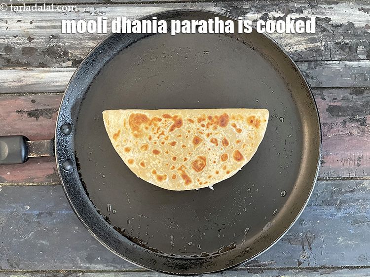 Step 44 – Keep flipping and cooking the paratha till golden brown. Your roti is ready.