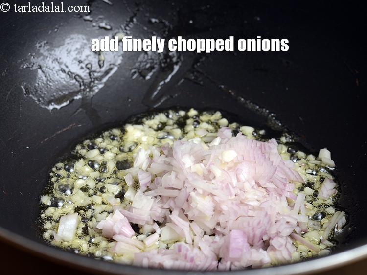 Step 24 – Add &frac14; cup finely <a href="https://www.tarladalal.com/glossary-chopped-onions-722i">chopped onions</a>.
