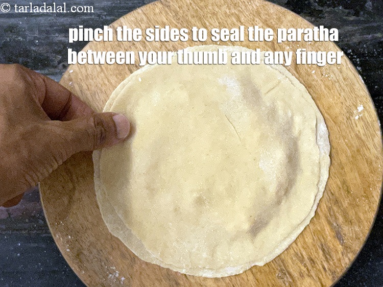 Step 39 – Place the other dough circle over it and seal it well using your finger.