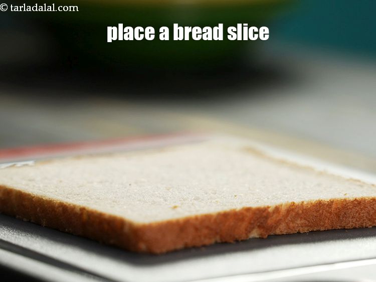 Step 22 – Place a bread slice on a clean dry surface.