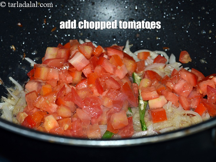Step 22 – Add &frac12; cup <a href="https://www.tarladalal.com/glossary-chopped-tomatoes-779i">chopped tomatoes</a>.