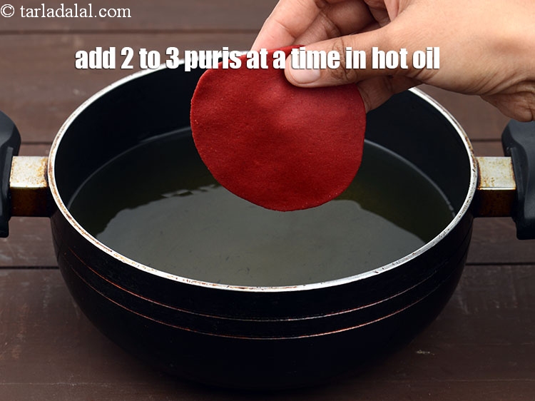 Step 21 – Heat the oil in a deep non-stick kadhai and add 2 to 3 puris at …