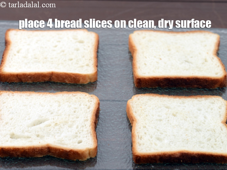 Step 22 – Place 4 <a href="https://www.tarladalal.com/glossary-bread-219i">bread</a>&nbsp;slices on a clean, dry surface.