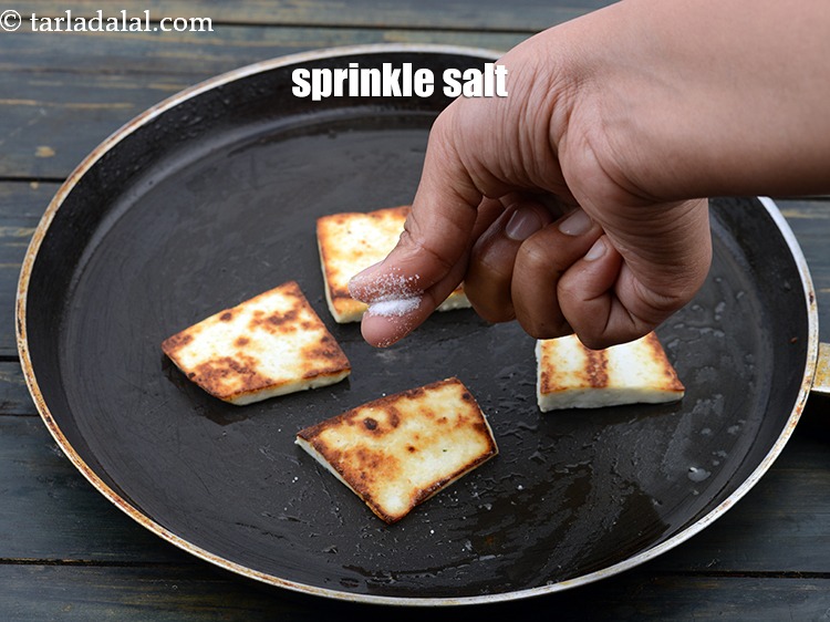 Step 23 – Sprinkle salt evenly over the paneer slices.