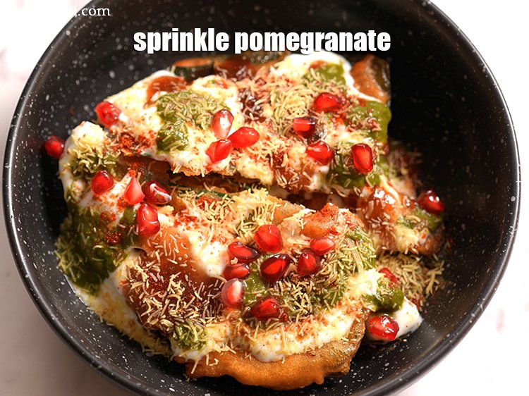 Step 22 – Sprinkle 1 tbsp <a href="https://tarladalal.com/glossary-pomegranate-anar-587i">pomegranate (anar)</a>.