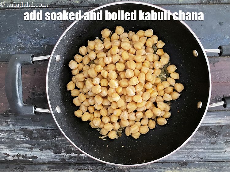 Step 22 – Add&nbsp;<meta charset="UTF-8" />2 cups&nbsp;soaked and&nbsp;<a href="glossary-boiled-kabuli-chana-1354i">boiled kabuli chana (white chick peas)</a>.